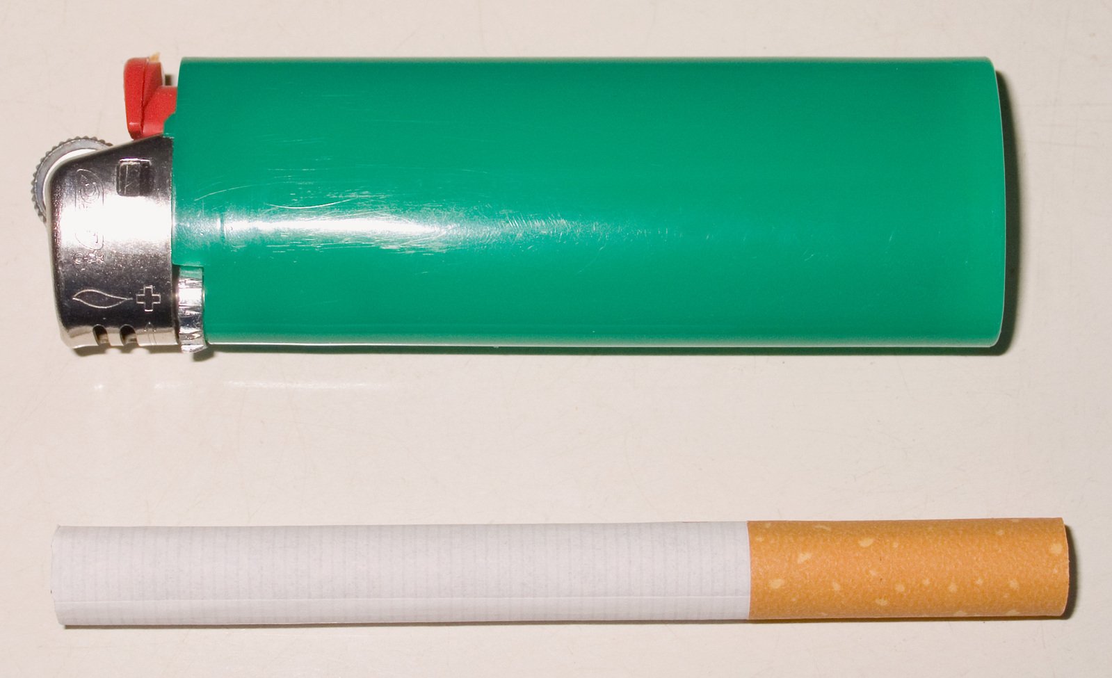 a cigarette, lighter and a green lighter are displayed