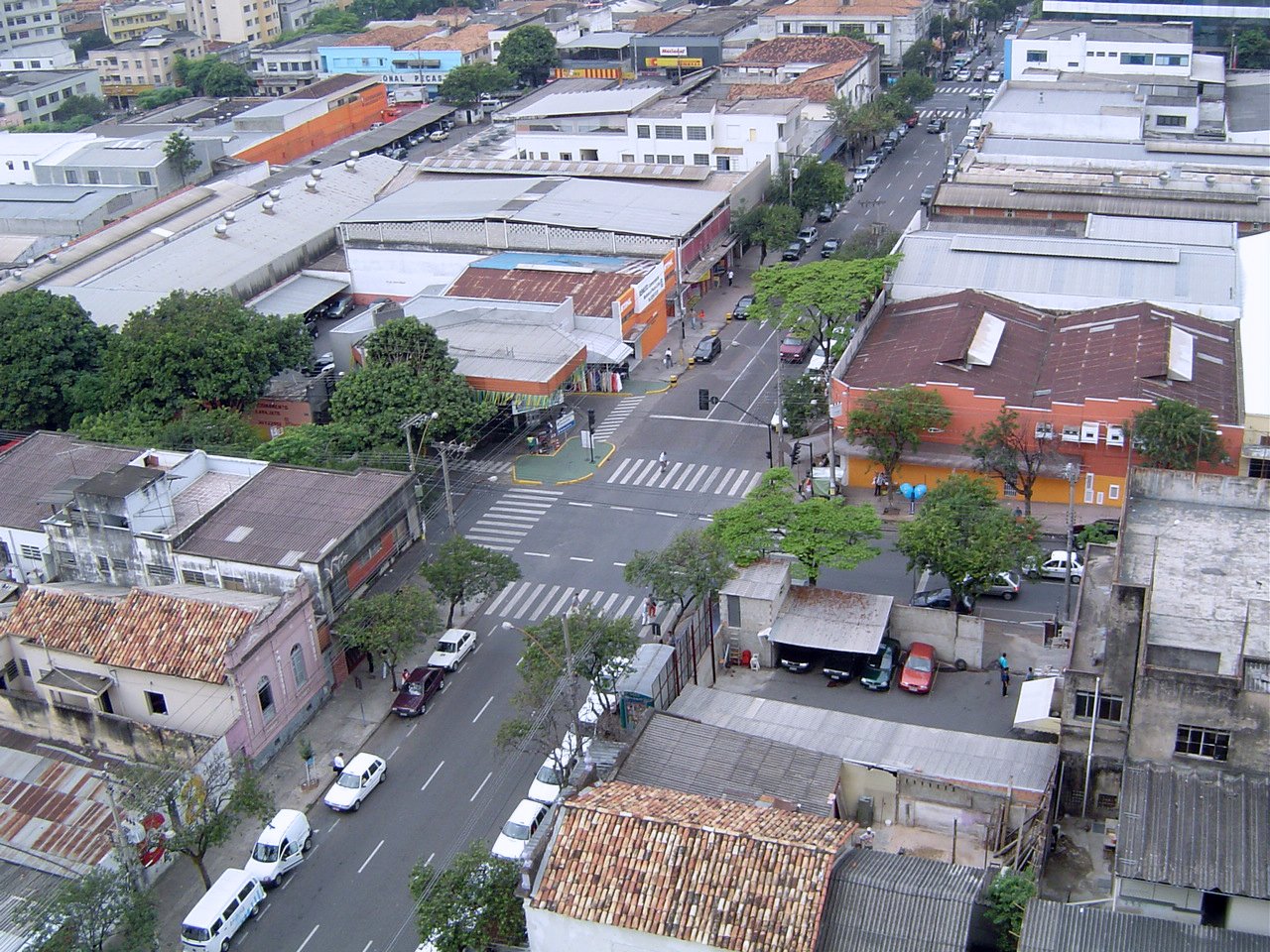 a cityscape is shown from above, with traffic