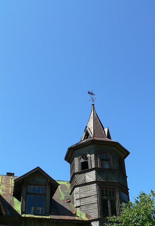 a clock tower is on top of the roof