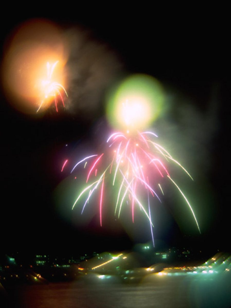 fireworks show with water in the background