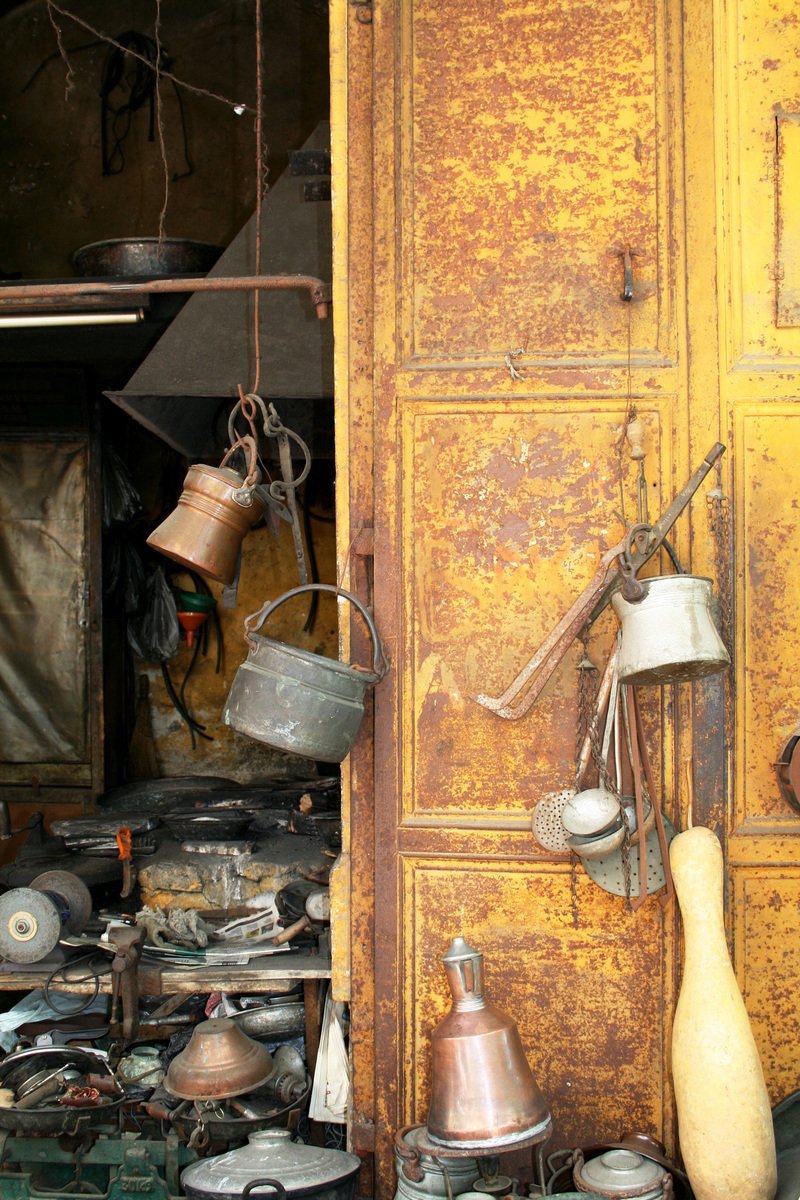 an old door, rusty wall and rusty lamp on the shelves