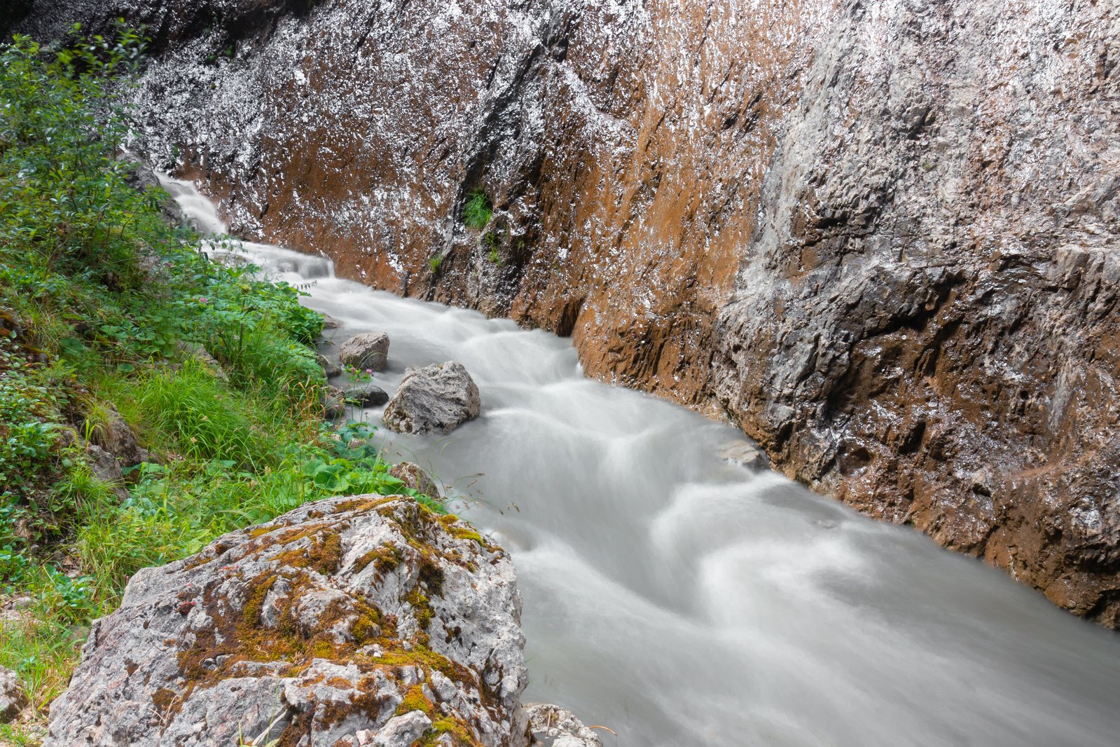 water flowing down rocks into a small river