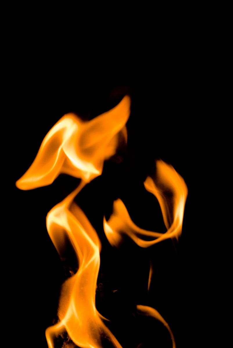 the fire is burning on the black background