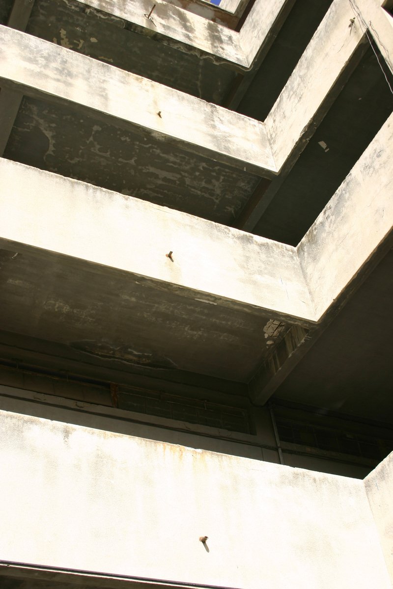a view from below the bottom of a building of large pillars