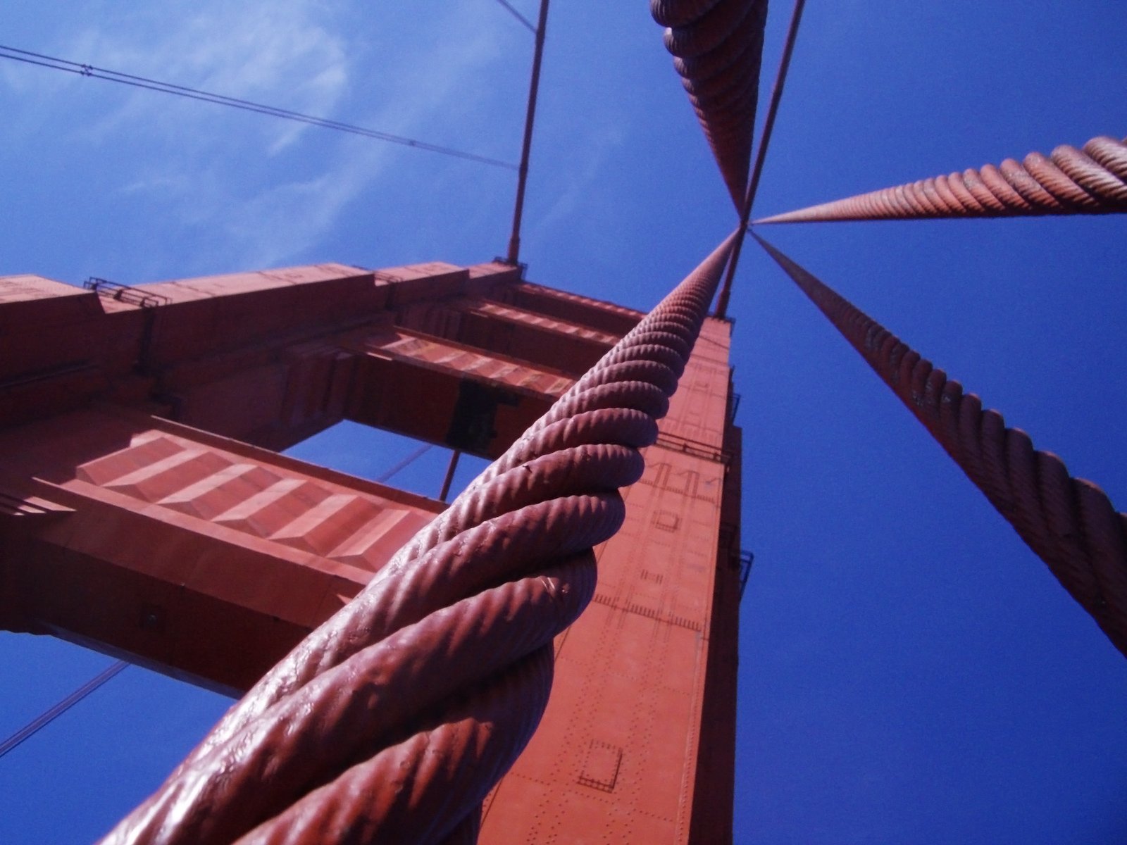 large long rope in between two red concrete structures