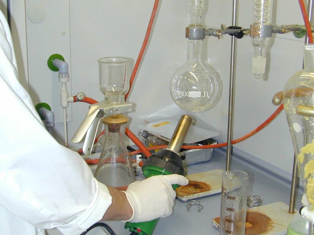 a man working with an experiment inside of a lab