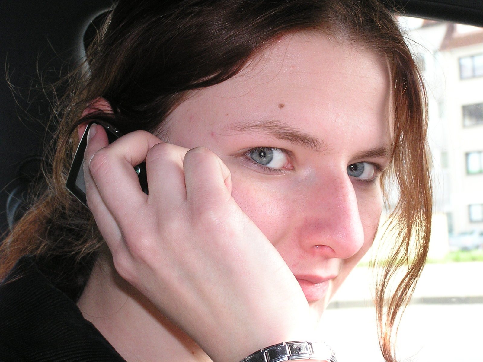 a close up of a person holding a cell phone