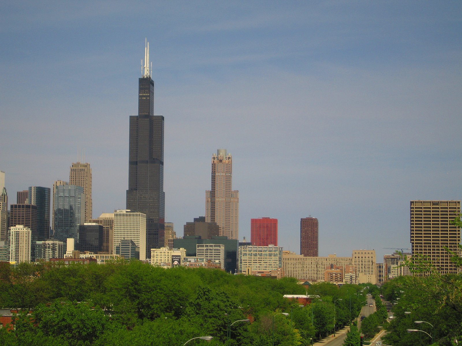 a large tall building towering over a city