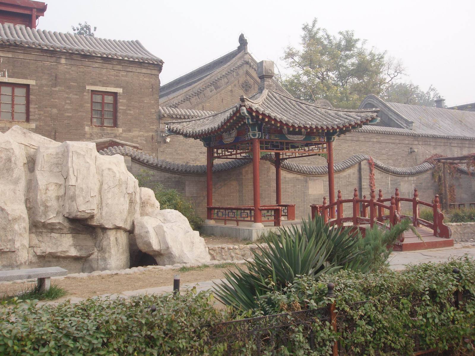 the asian architecture is located in front of rocks