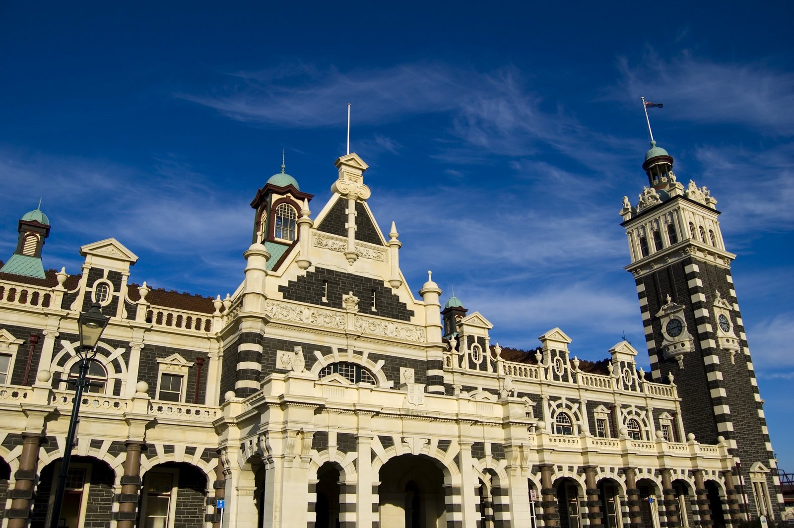 an ornate building with a steeple and two towers