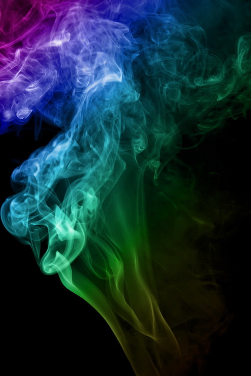 color smoke rising in different colors with black background