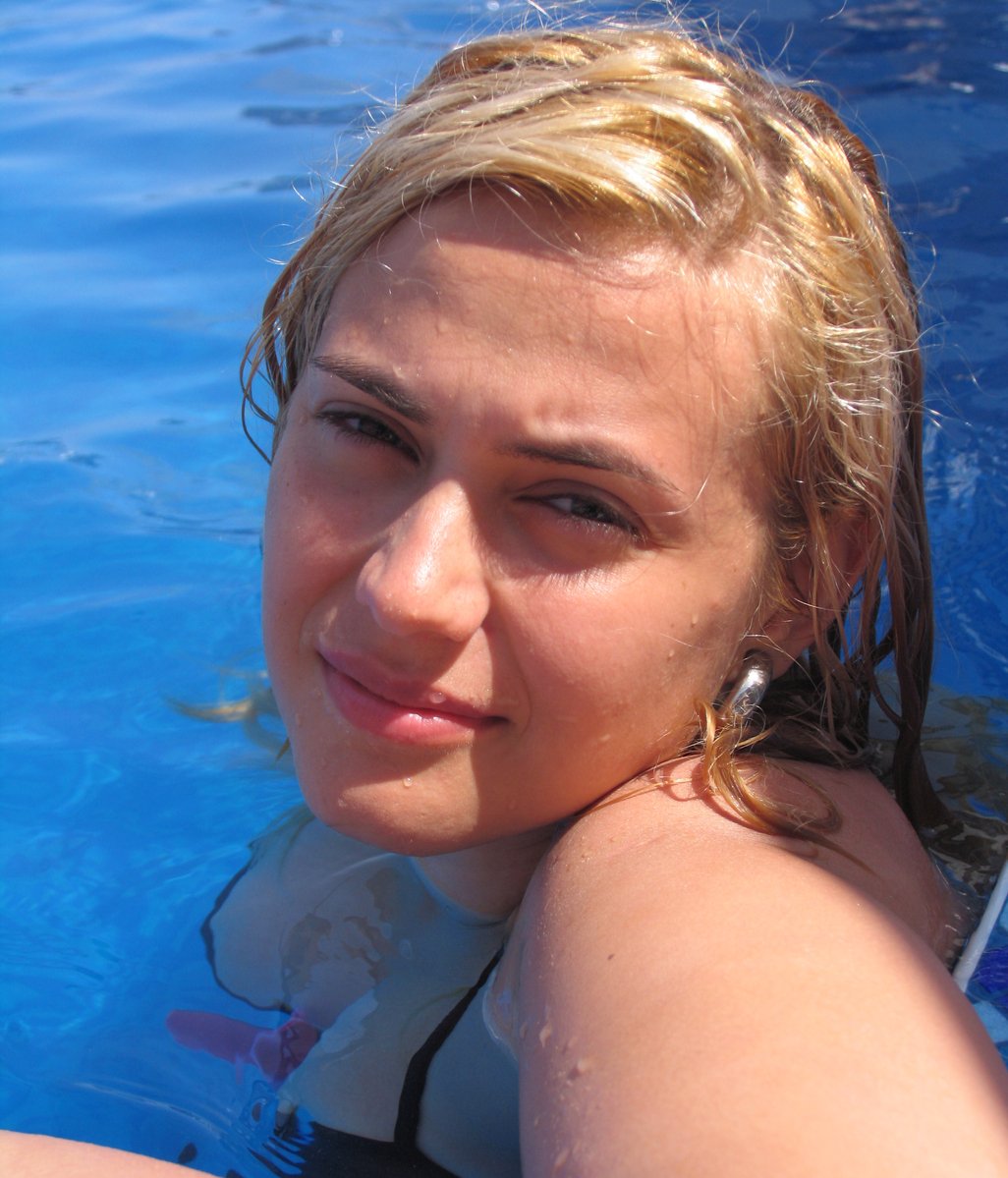 a woman sits on a raft looking straight ahead