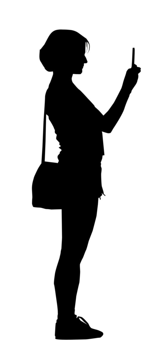 silhouette woman standing while holding cell phone in her hand