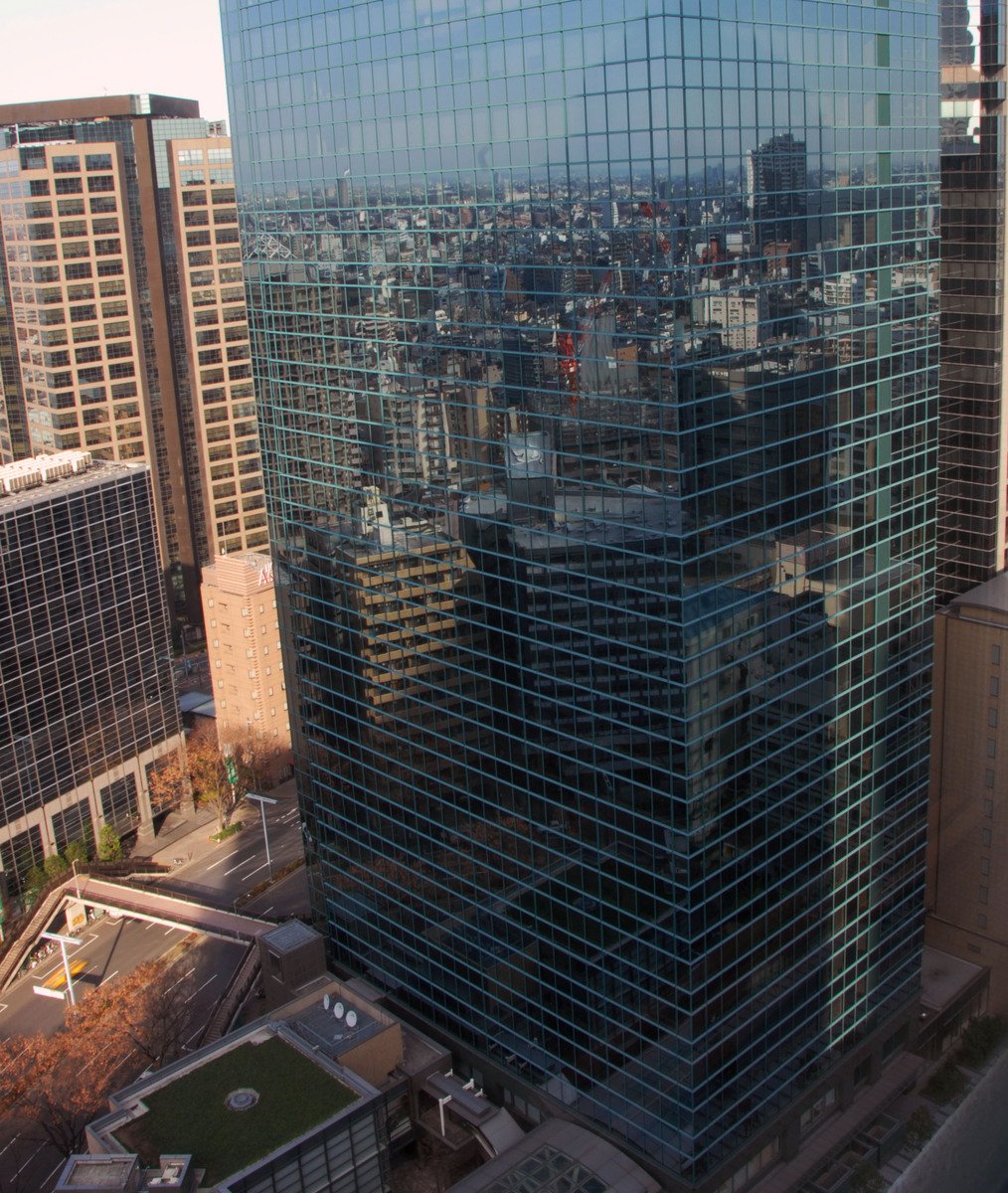 an aerial view of skyscrs in a city