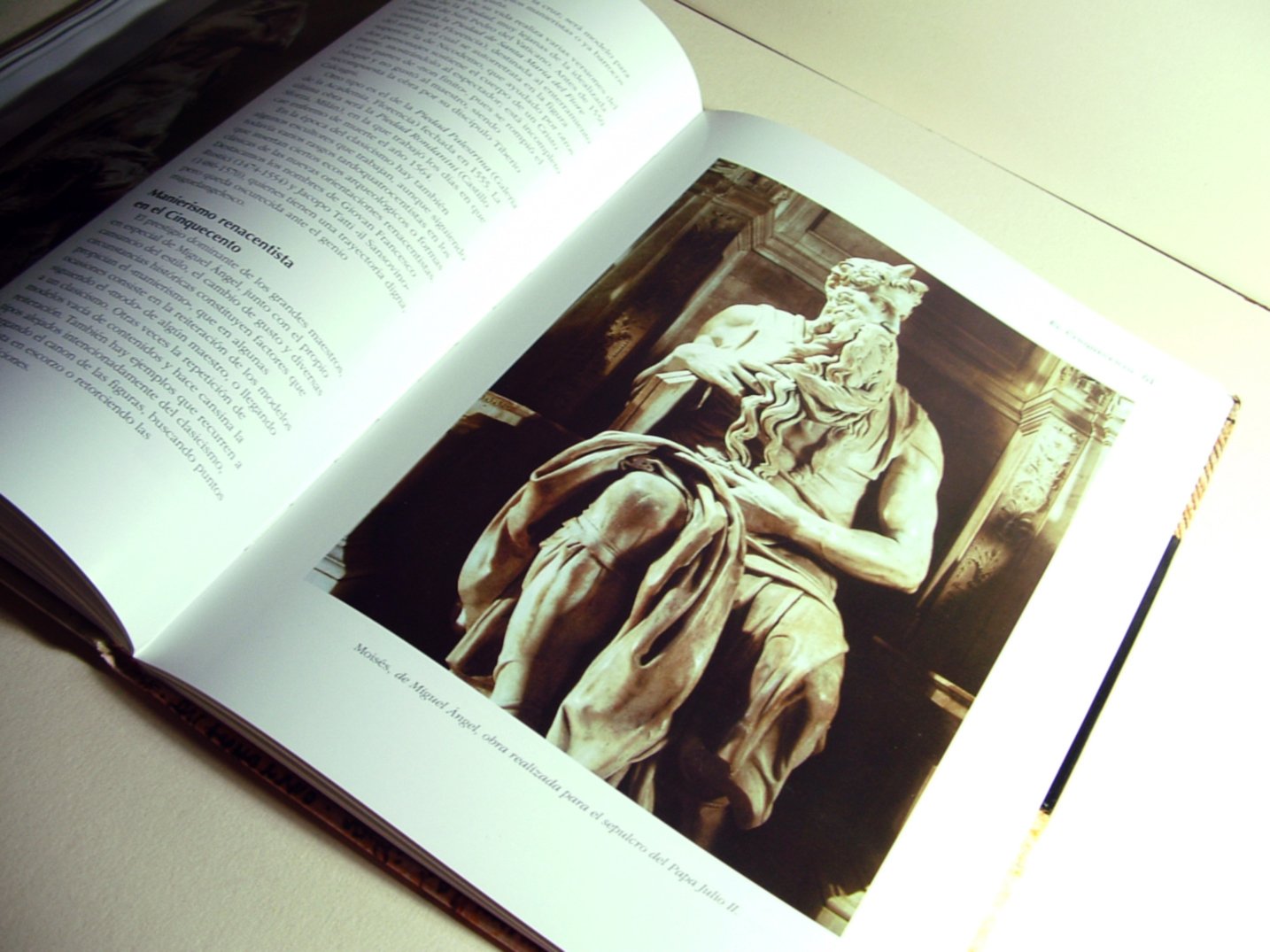 a po book showing a statue in an old style