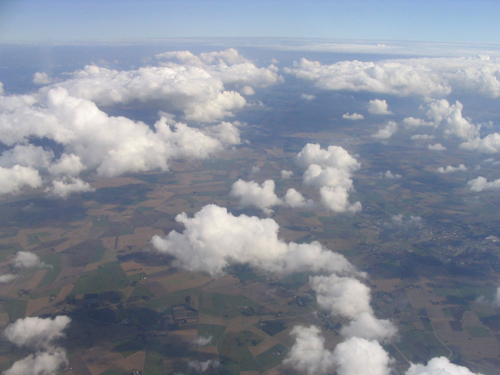 white clouds seen from above on a clear day