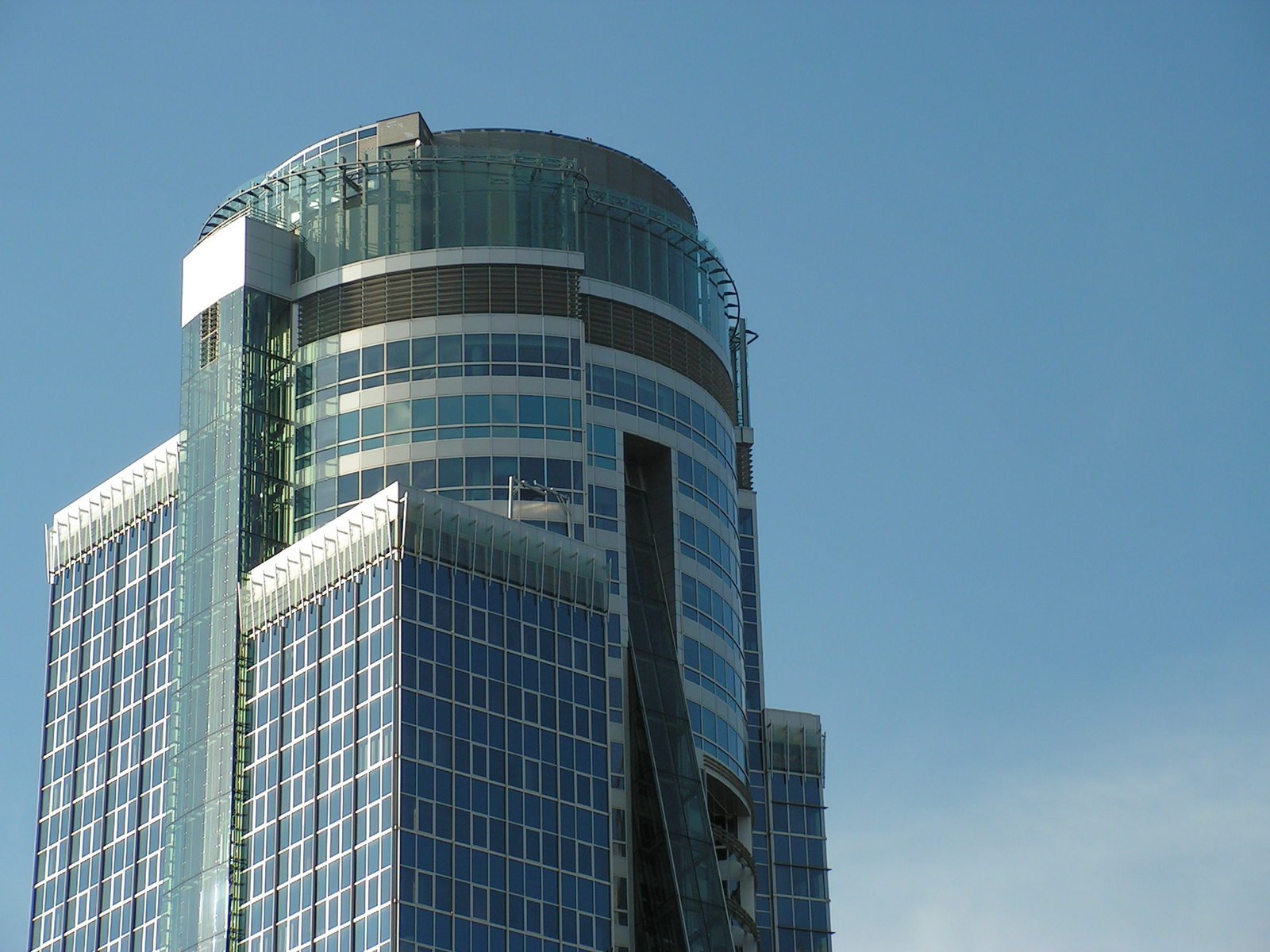 an architectural building is against a blue sky