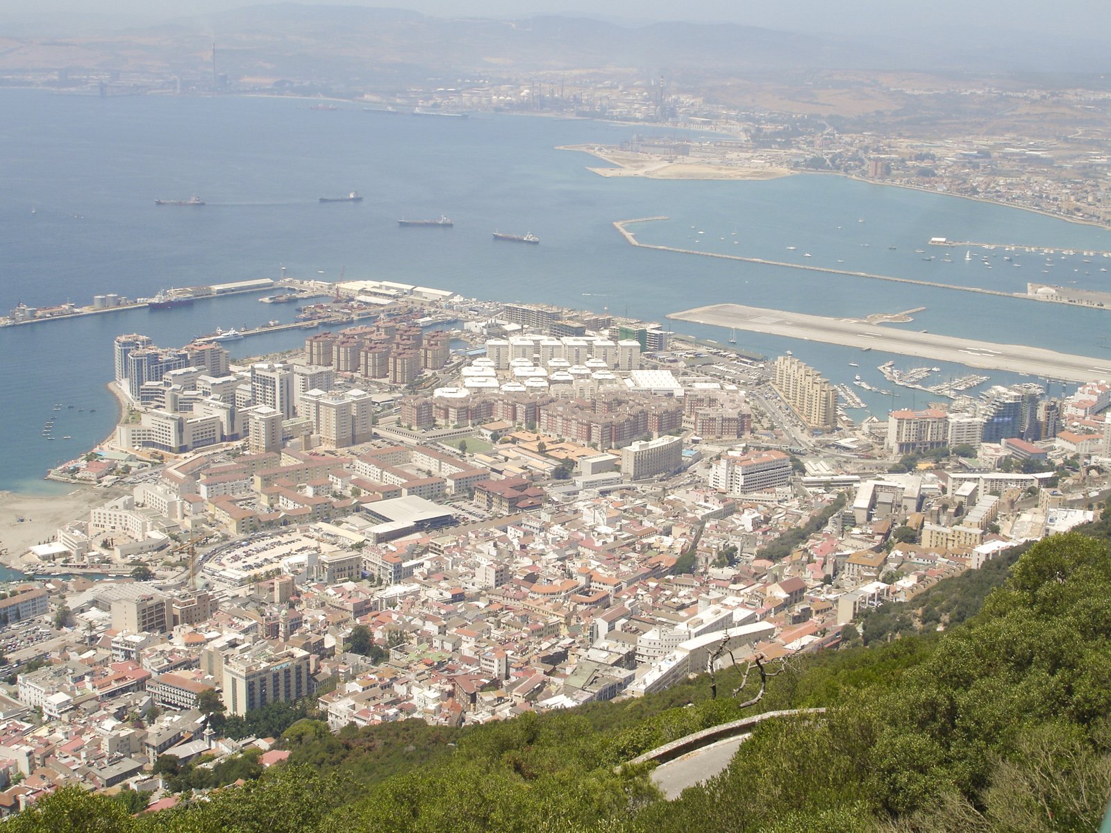 a scenic view of a city near a body of water