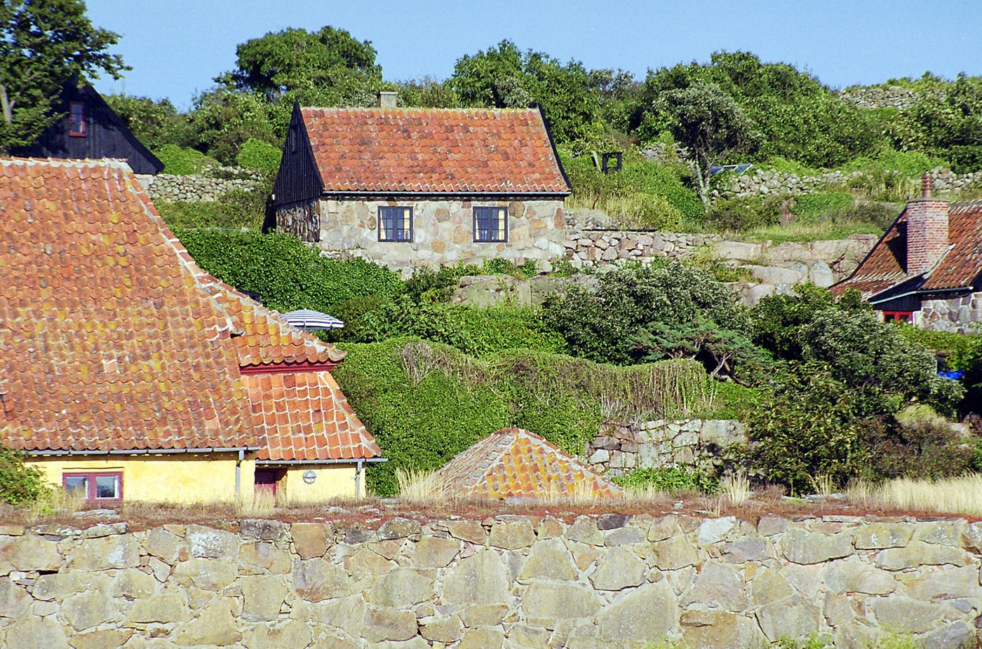 a village on the hillside is a house and buildings
