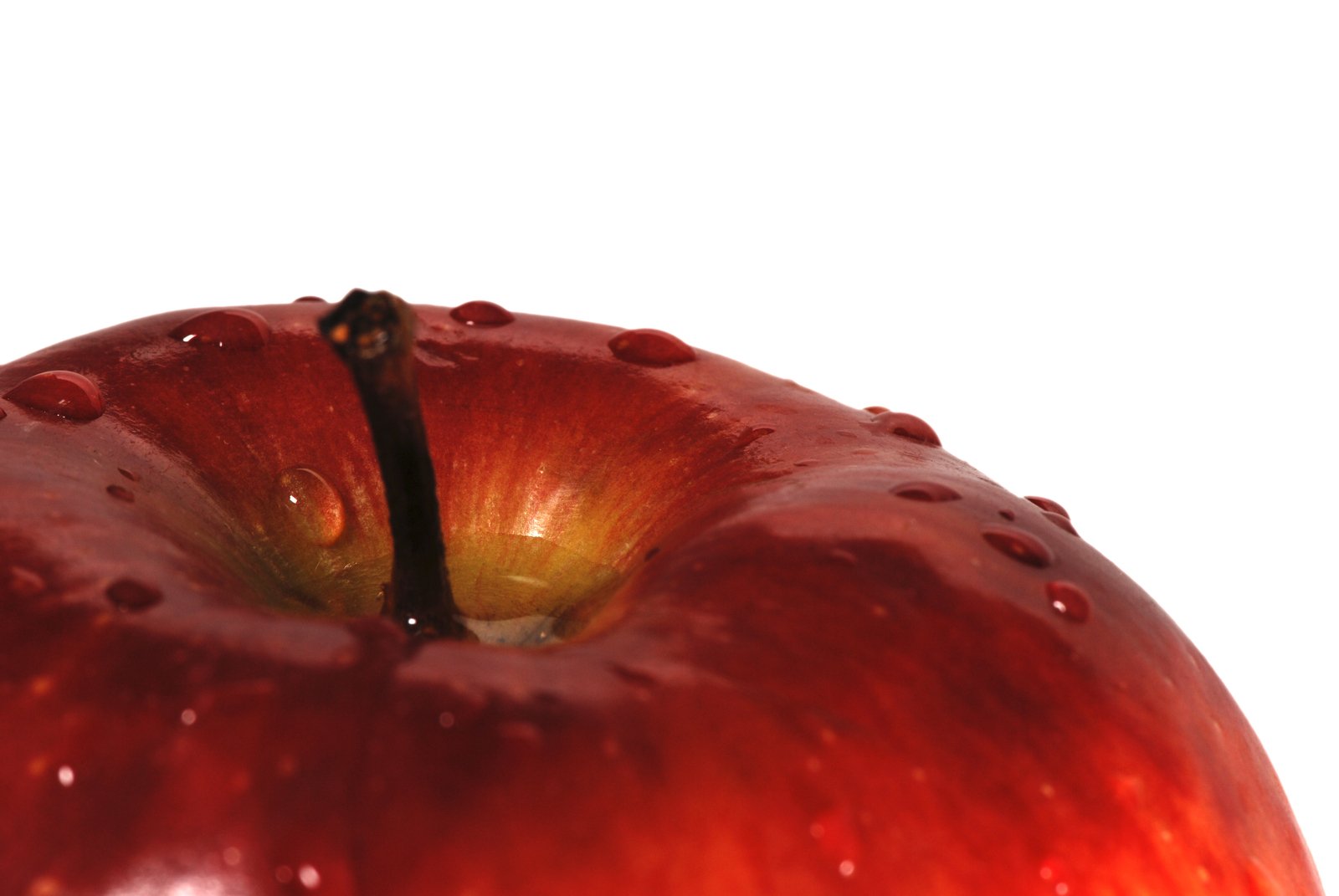 a red apple with drops of water on it