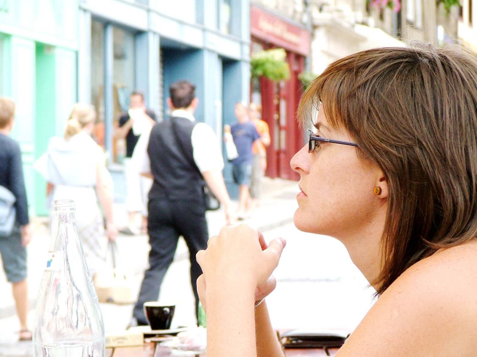 there is a woman eating food on the street