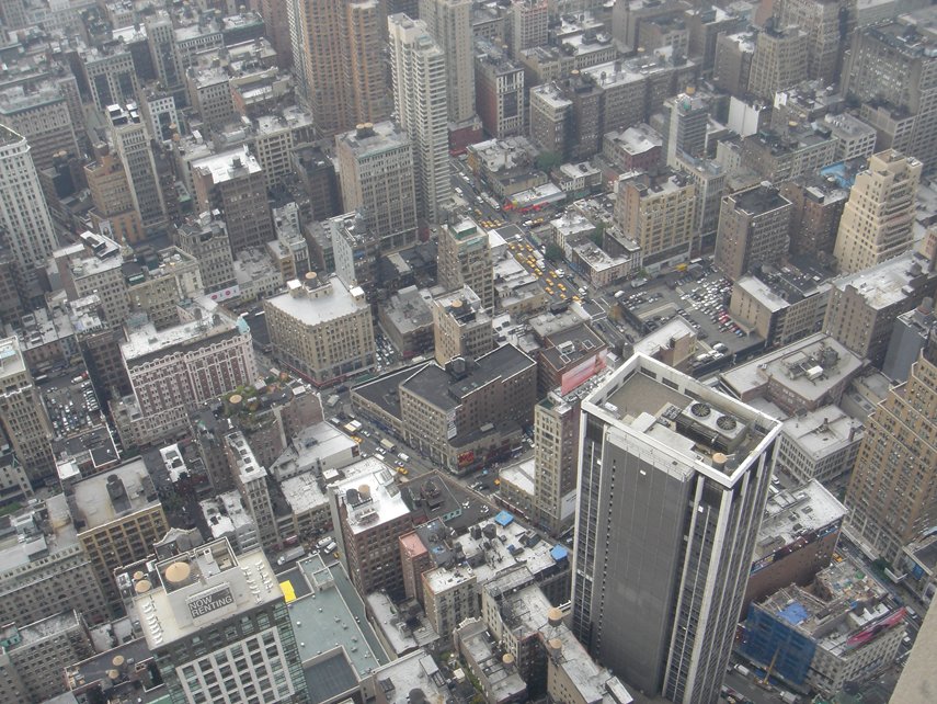 an aerial view of a city in the day