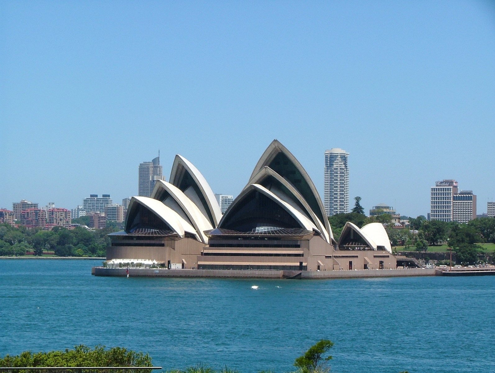 a large body of water with very tall buildings near by