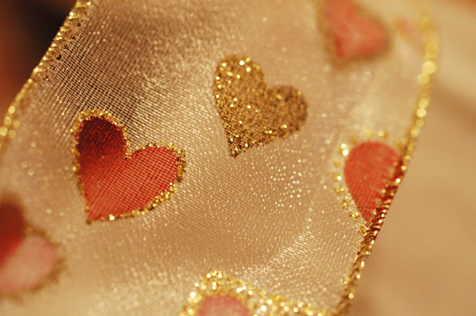 a gold neck tie with heart cut out
