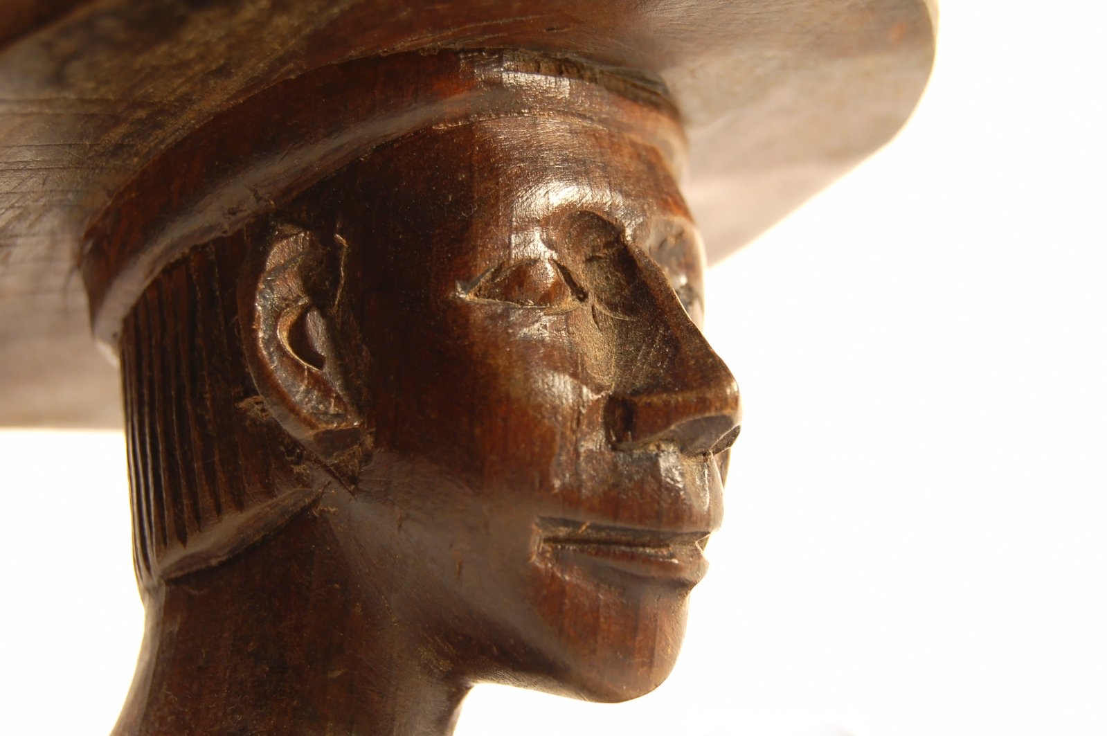 a carved wooden head in a close up s