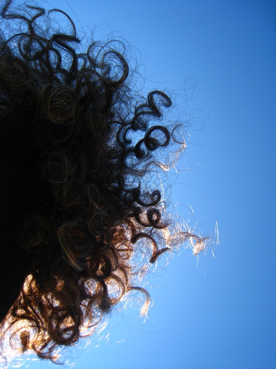 the reflection of a woman's hair from below