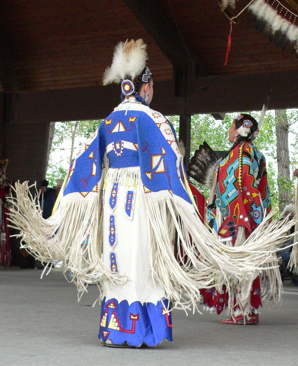 an image of three indian men performing a dance