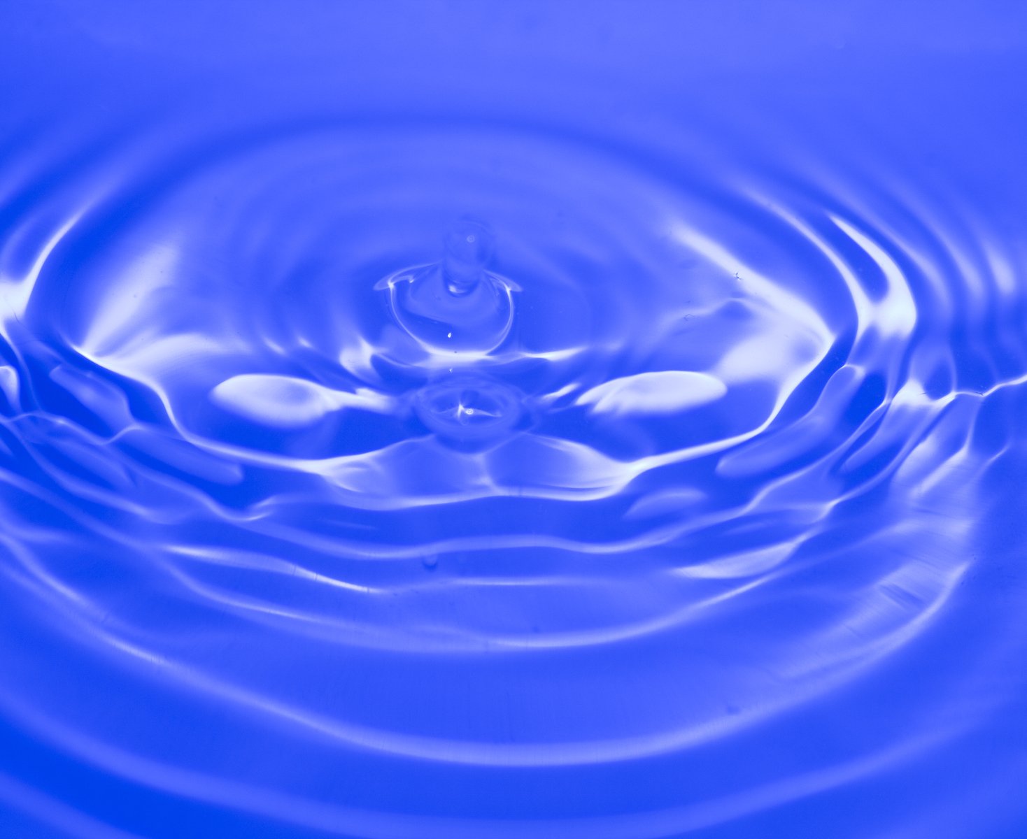 a liquid droplet being captured from a bowl