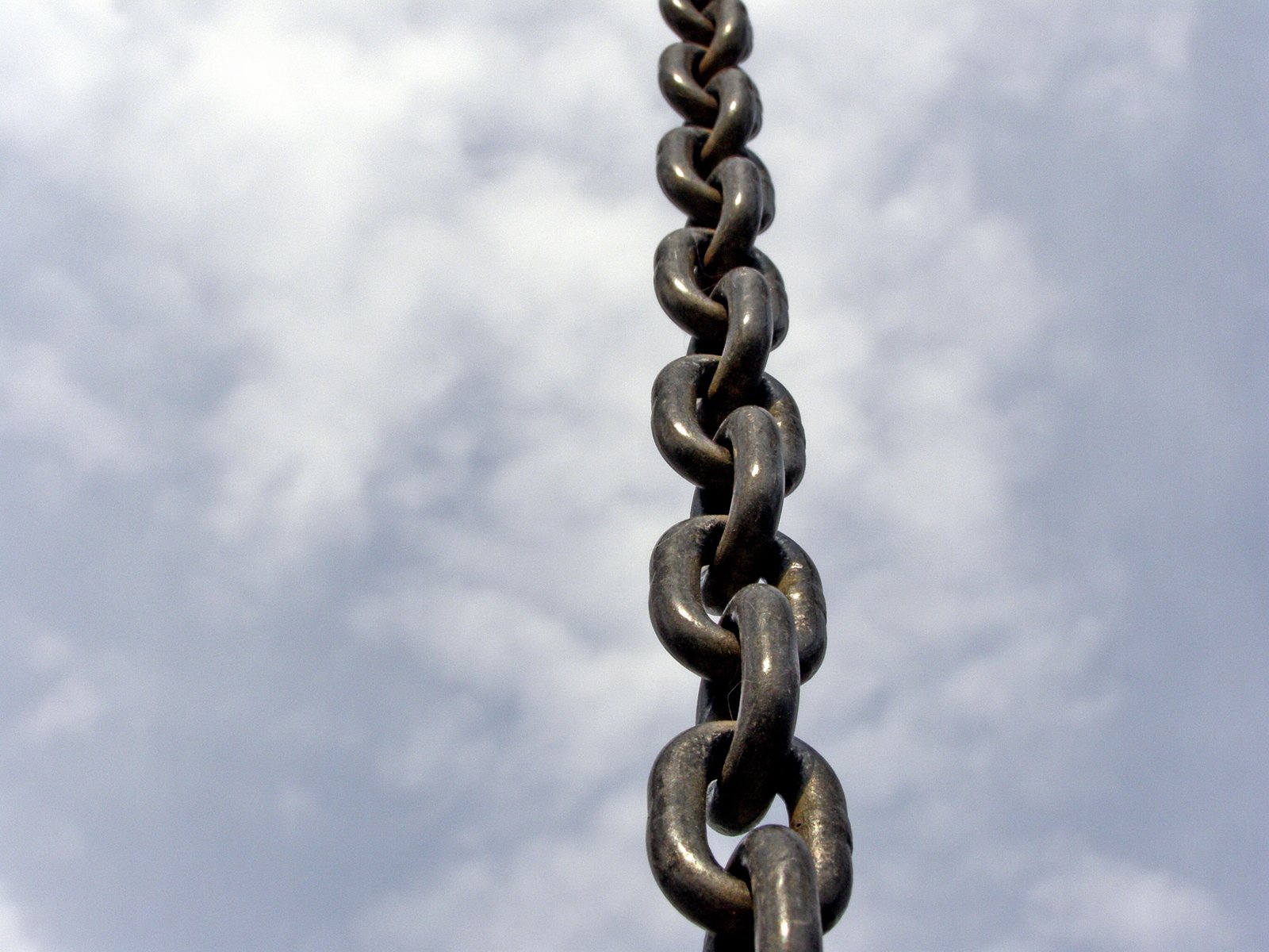 a metal link on top of a tall building