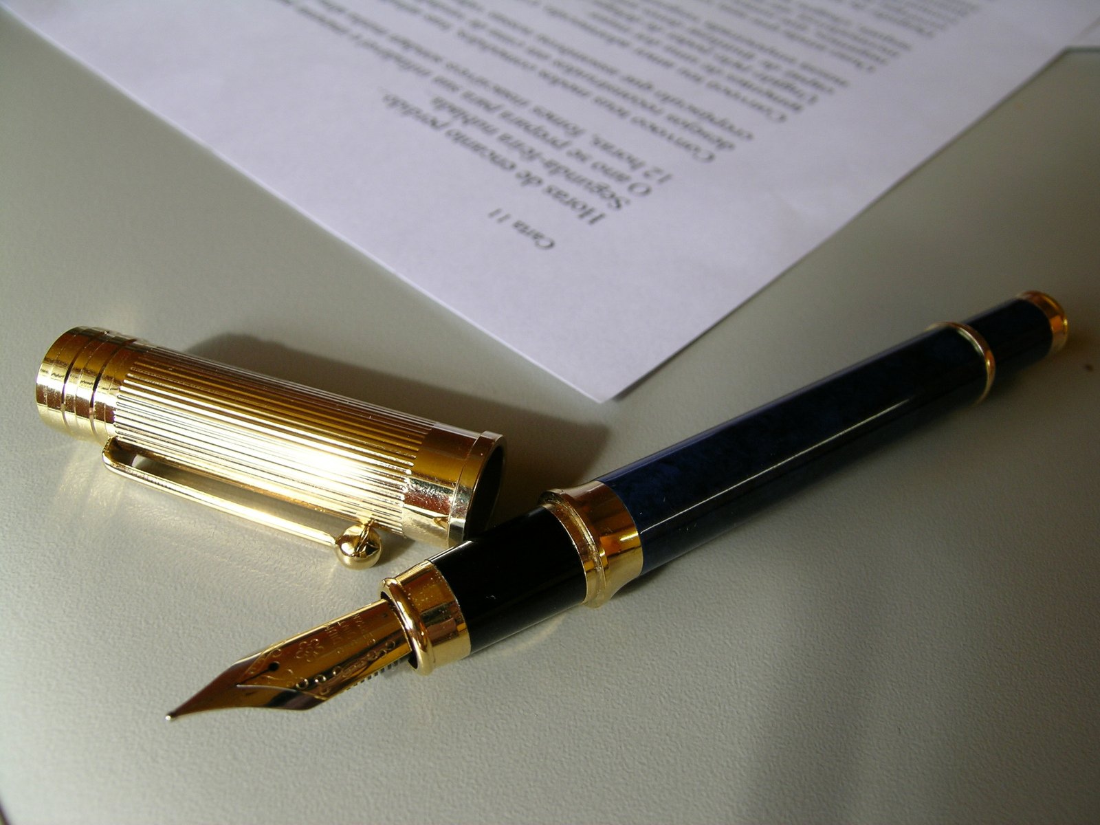 a fountain pen resting on a sheet of paper