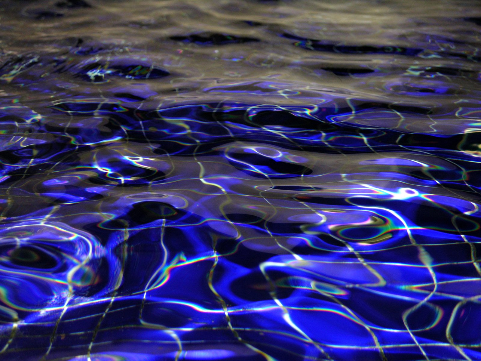 a pool that has a lot of blue water in it