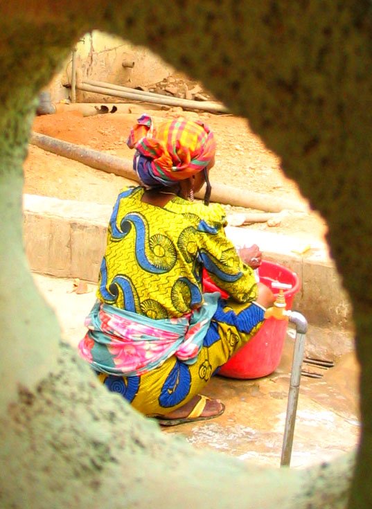 an image of woman with colored hair sitting outside