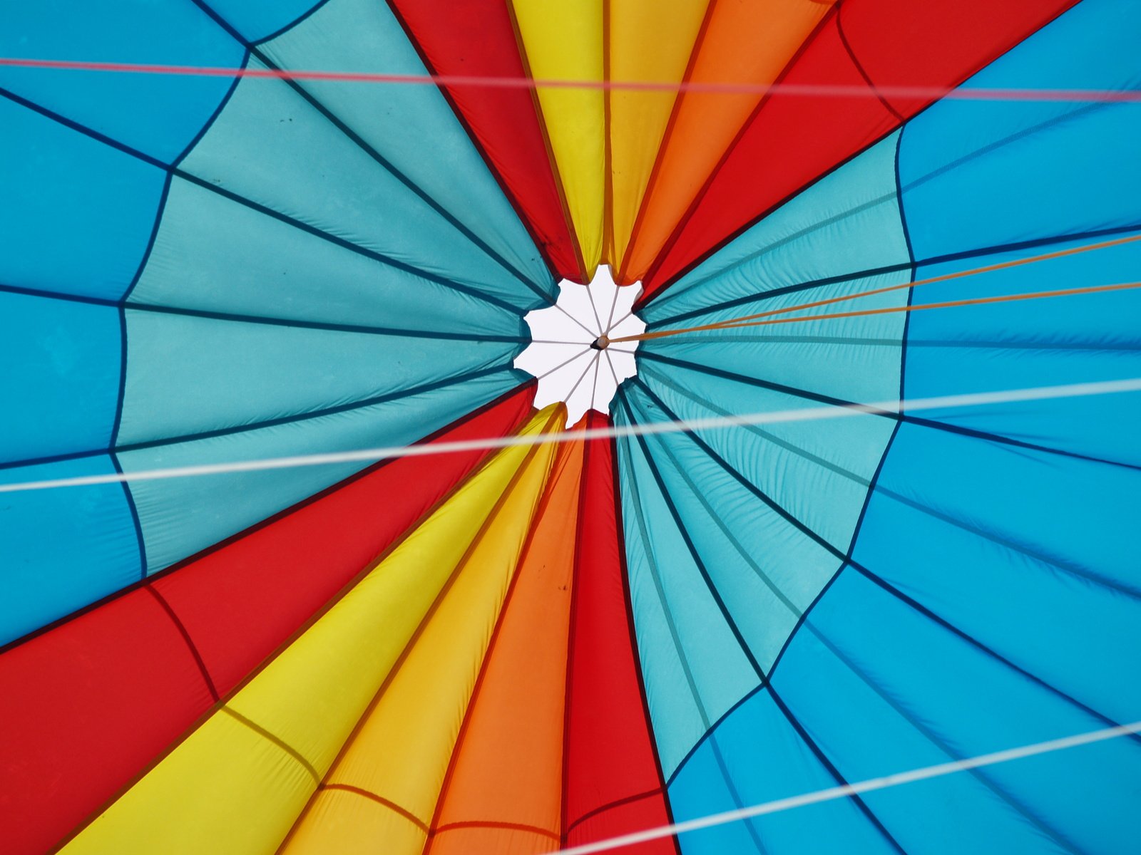 the inside of a colorful kite is shown