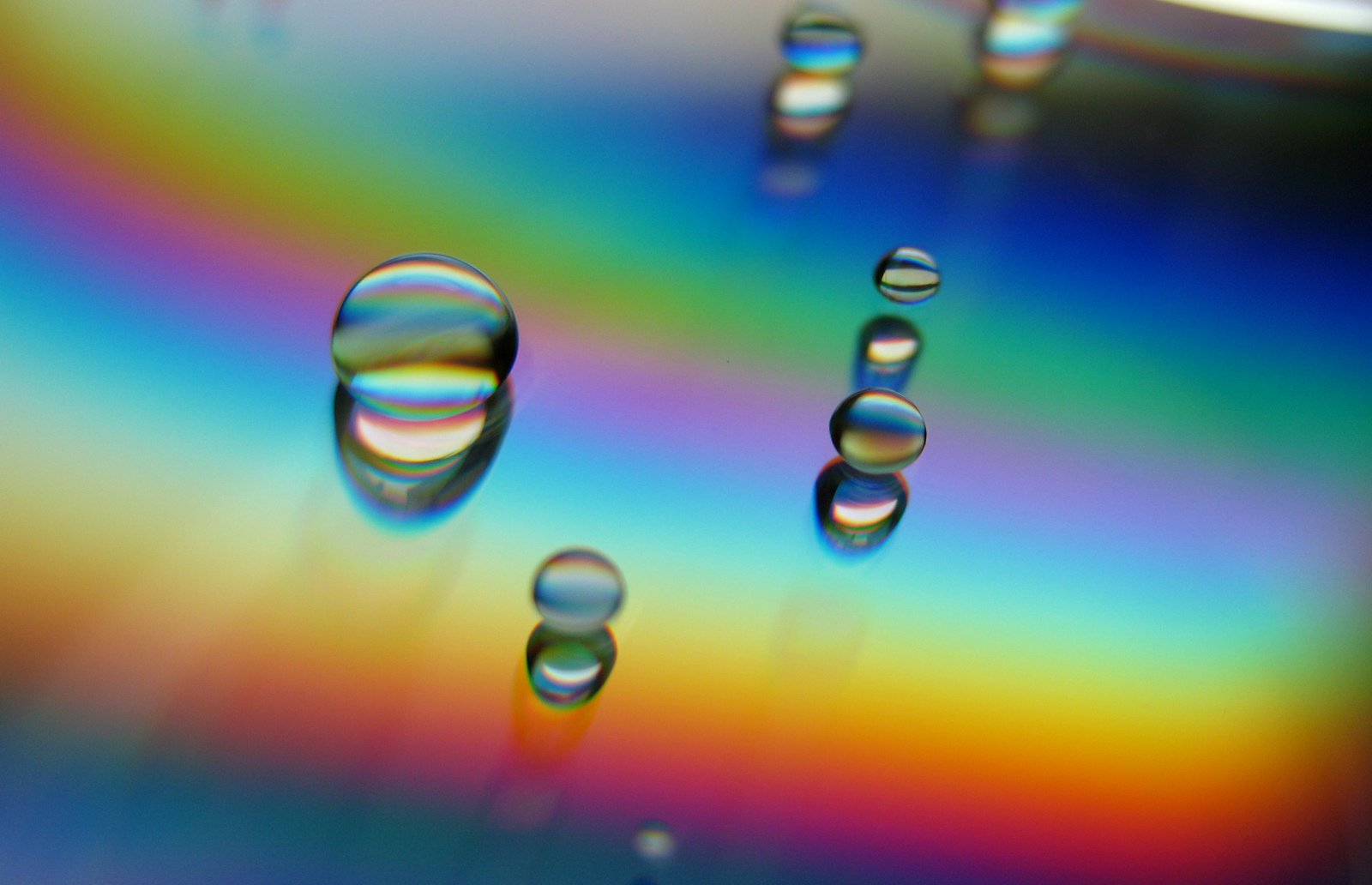 a collection of bubbles sitting on top of a colorful surface