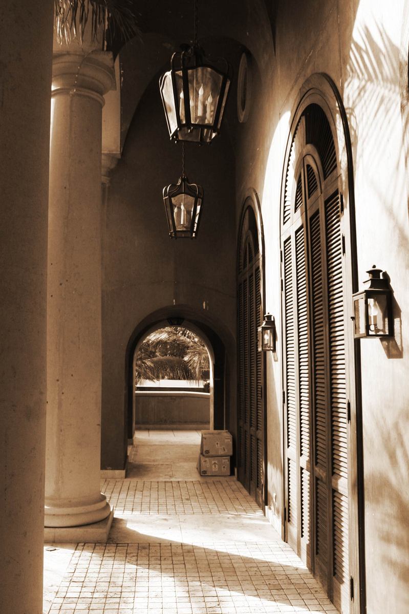 an ornate walkway leads to the front of a building