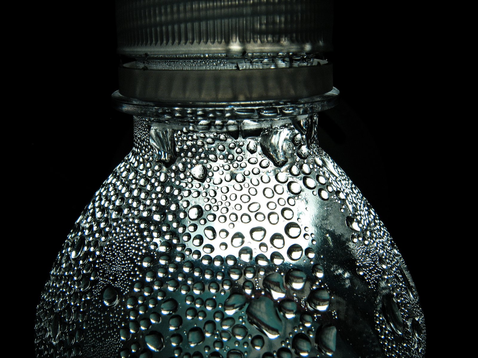 a glass bottle with water droplets on it