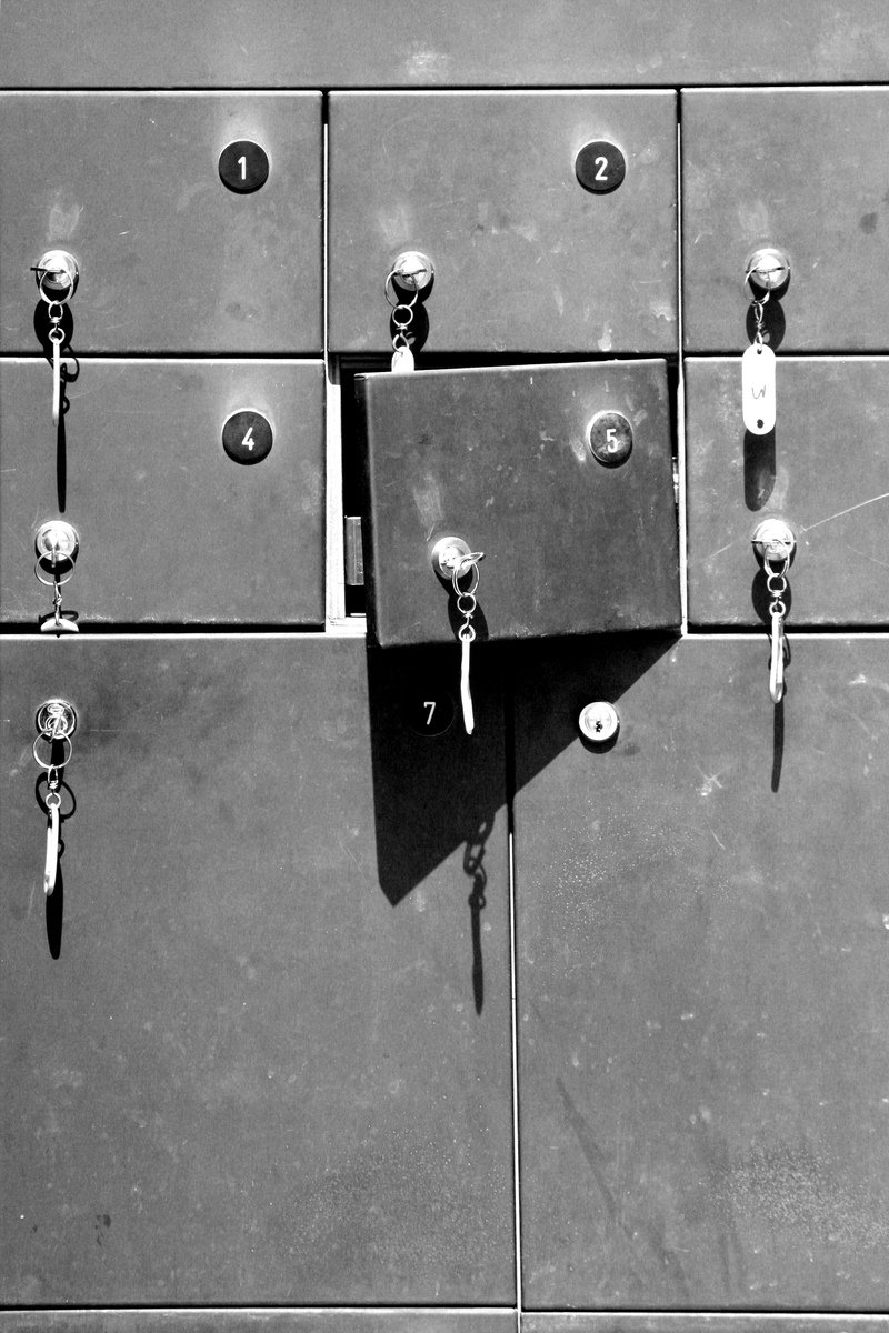 a row of lockers with handles attached to them