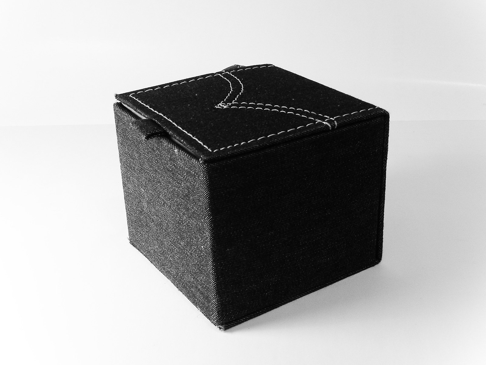 a small box sits on top of a white floor