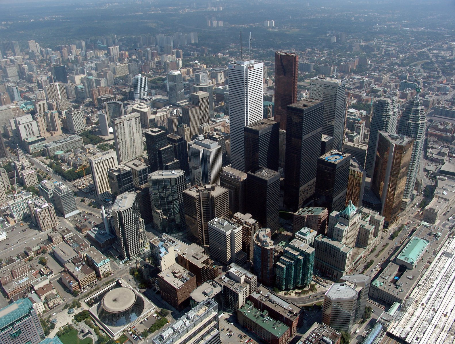 an aerial view of many city skyscrs in a large city