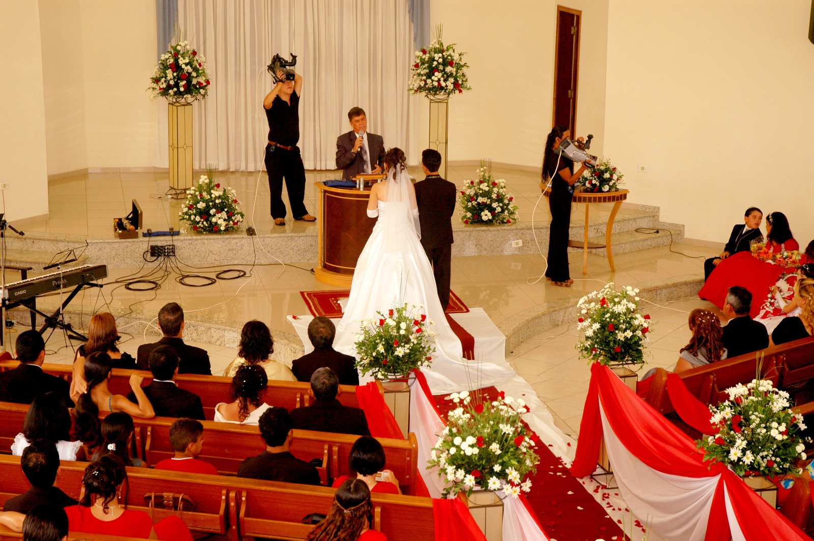 the bride and groom are being pographed at this wedding ceremony