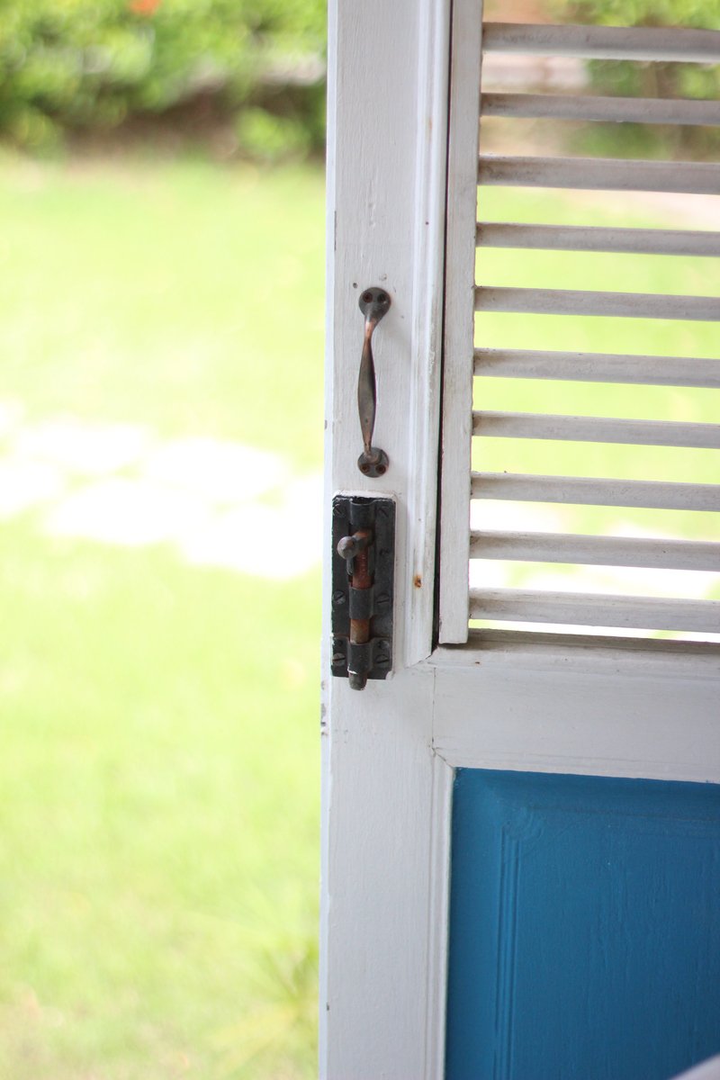 a close up of the front door  on a white door