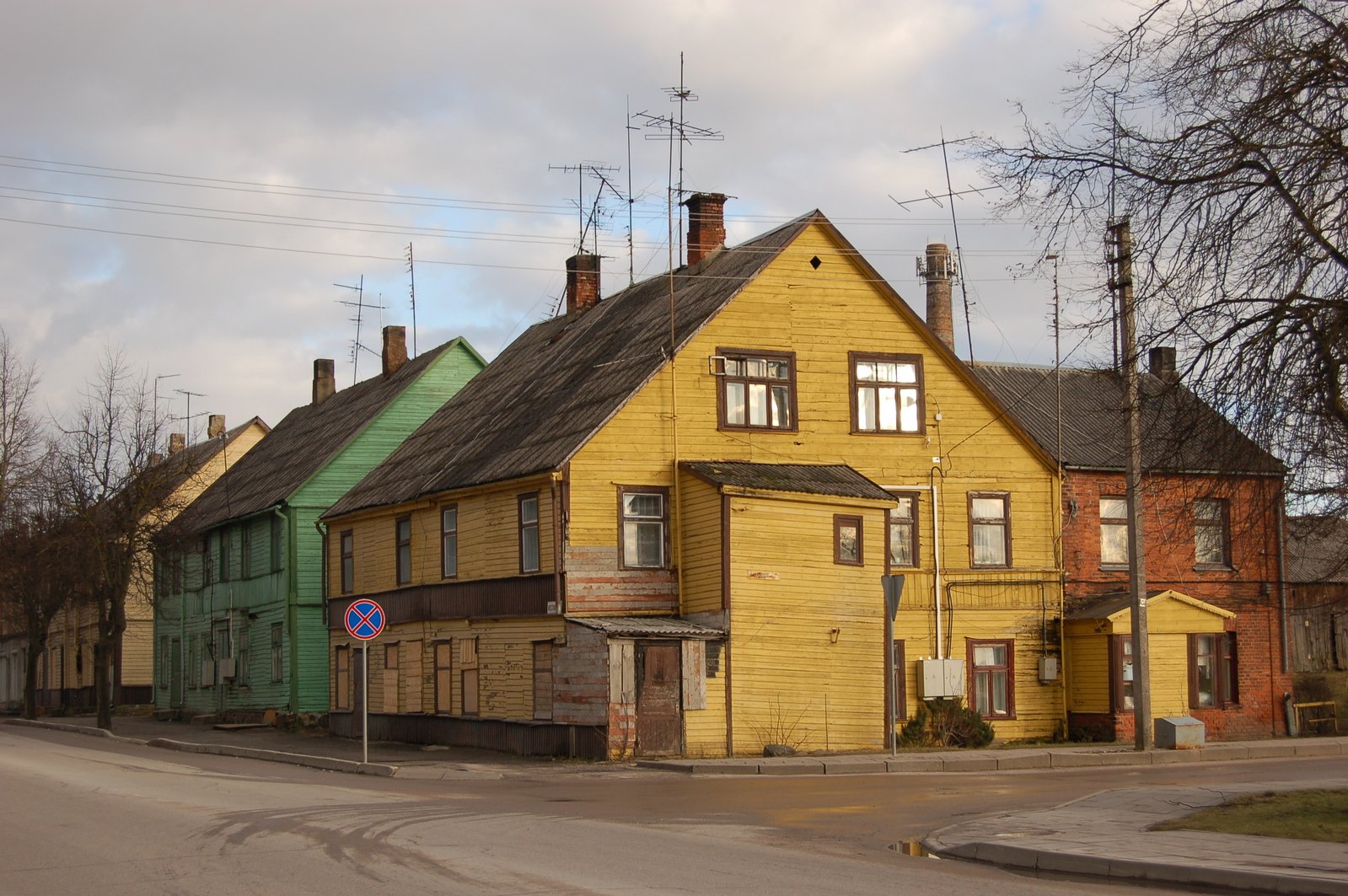a row of houses painted yellow in the foreground