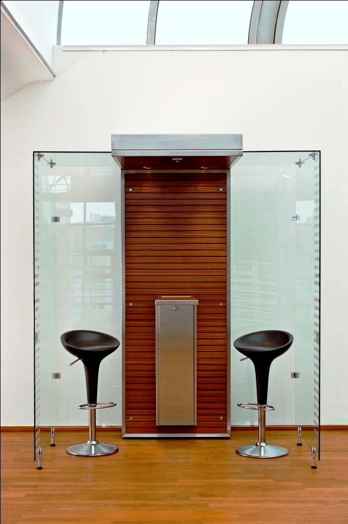 a door with two speaker attached to the glass