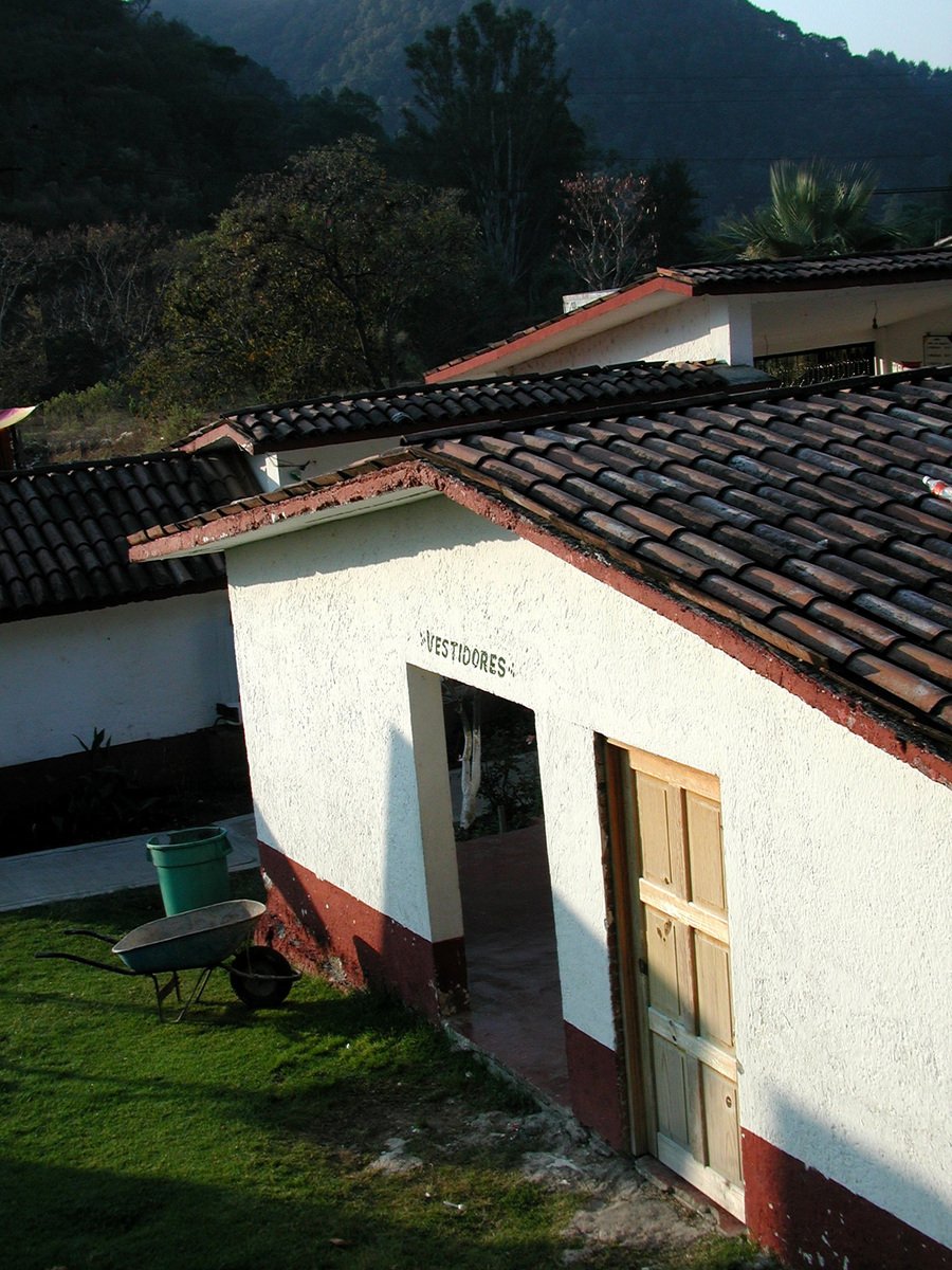 a view of a building that has a black and red roof