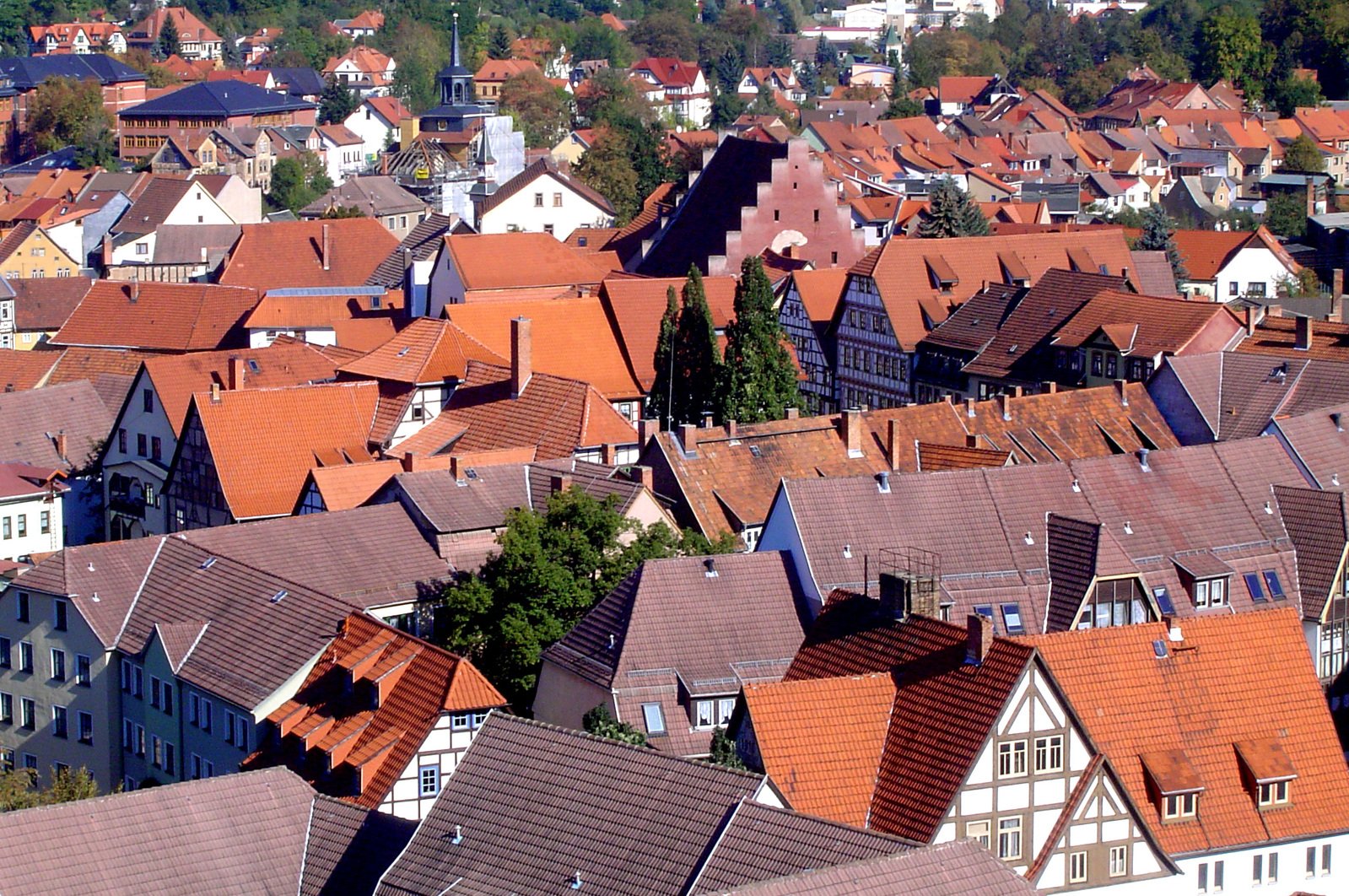 the tops of many buildings are covered in orange tile