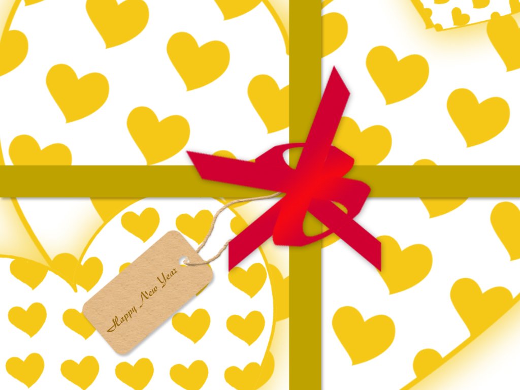 a gift wrapped in paper with red ribbon and a tag